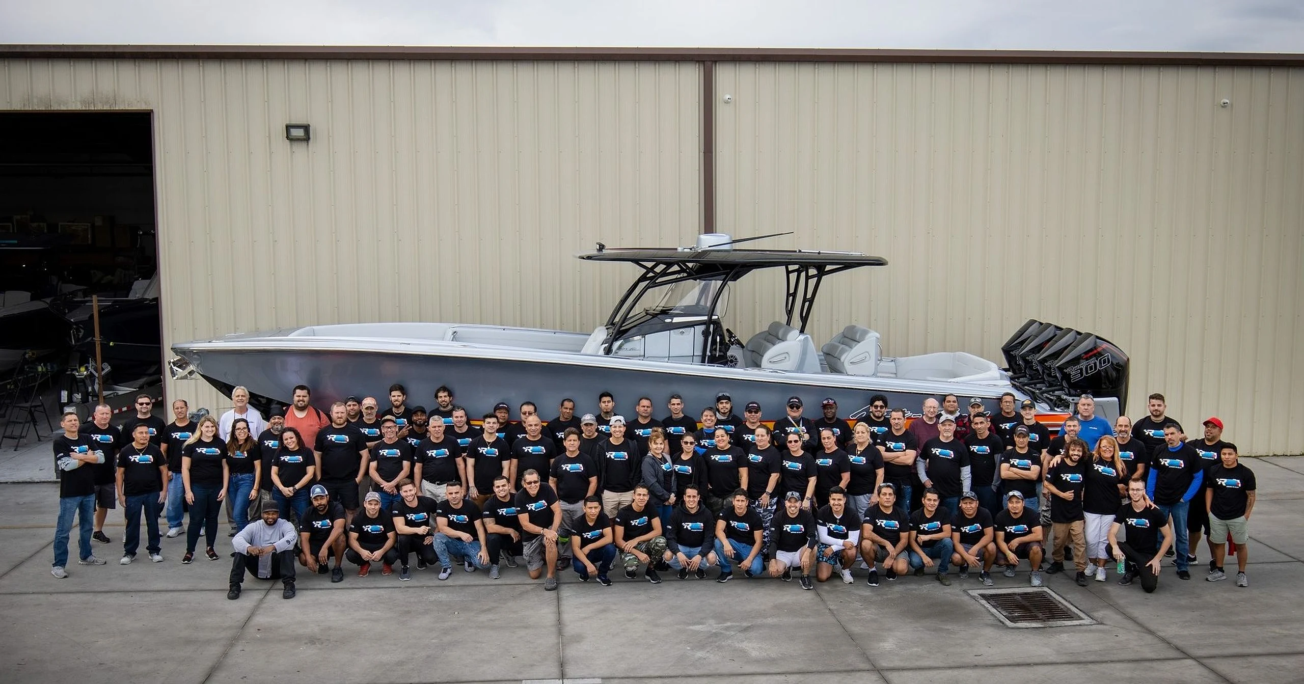 The Nor-Tech team in front of a finished boat in Cape Coral